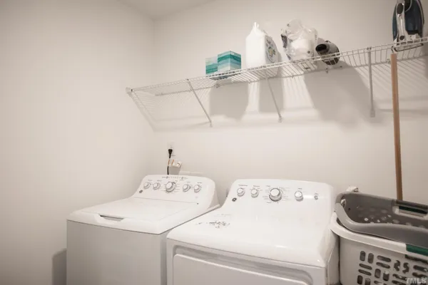 a bedroom with a bed and a hallway