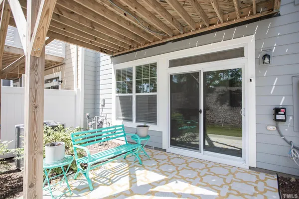 a backyard of a house with outdoor seating
