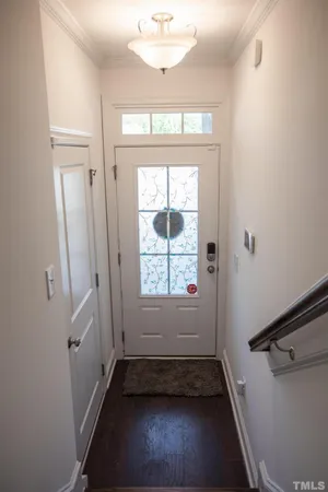 a view of entryway with livingroom and wooden floor