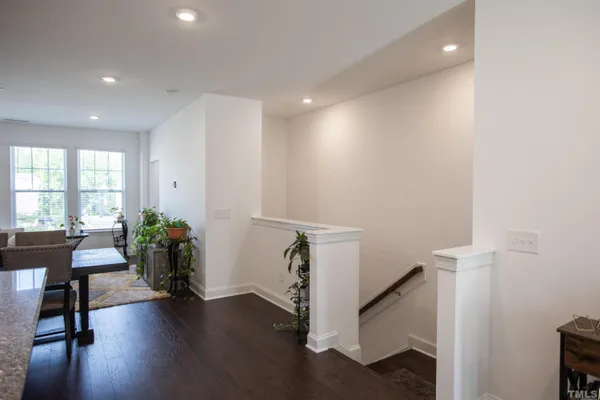 a kitchen with stainless steel appliances granite countertop a sink refrigerator and cabinets