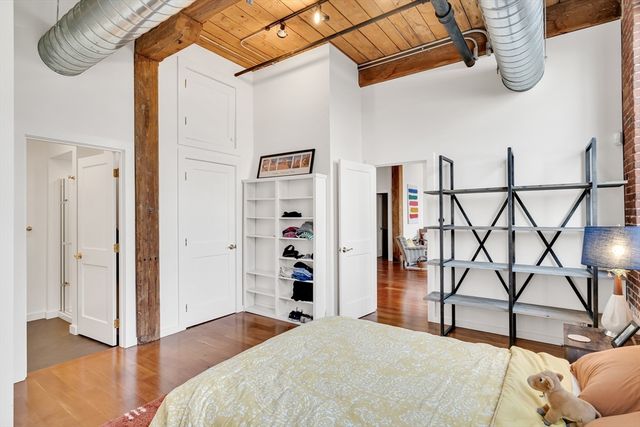 a bedroom with a bed and a walk in closet