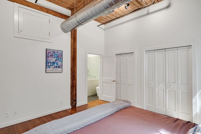 a bedroom with a bed and a view of bathroom