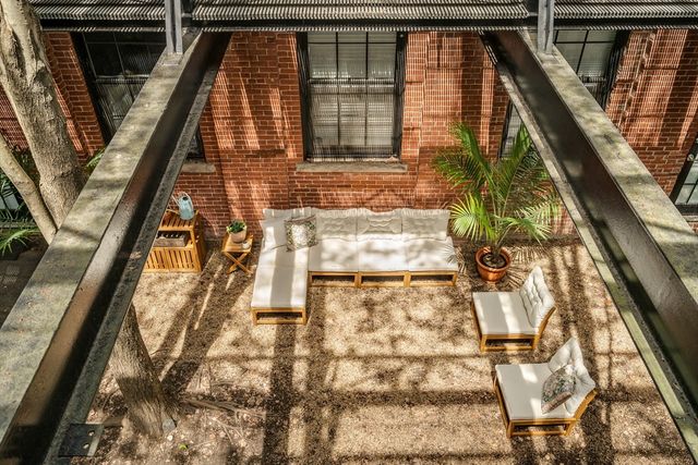 a view of a large building with a lounge chair