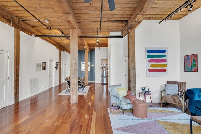 a outdoor space with lots of furniture and wooden floor