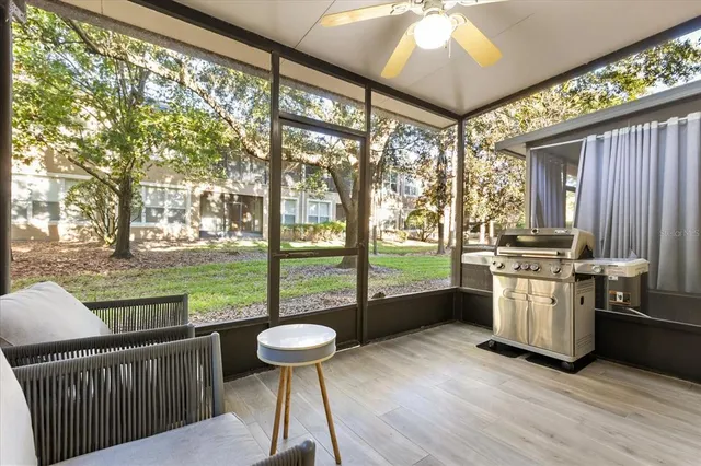 a kitchen with sink and wooden floor