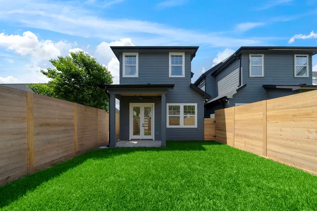 a brick house with a small yard