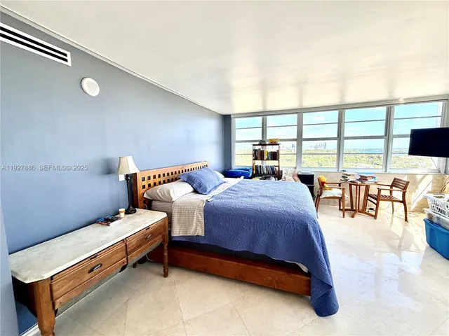 a bed room with a bed and a table