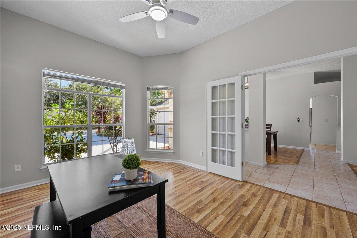 1940 Bluebonnet Way Fleming Island, FL 32003 - Photo 16 of 44 a view of a dining room with furniture and wooden floor
