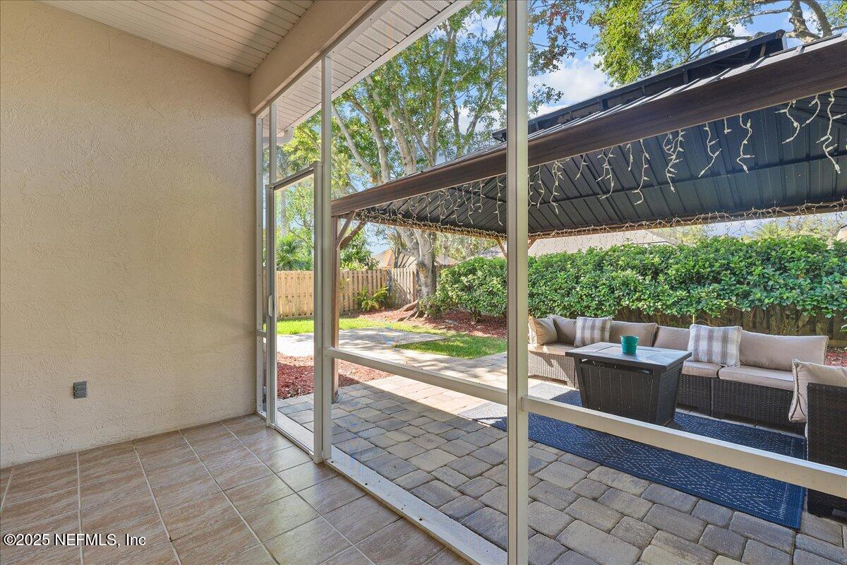 1940 Bluebonnet Way Fleming Island, FL 32003 - Photo 25 of 44 a view of a patio with a table and chairs