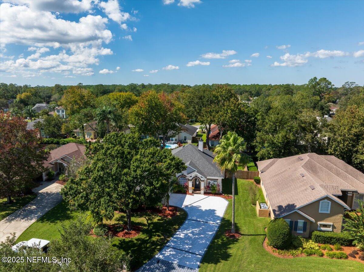 1940 Bluebonnet Way Fleming Island, FL 32003 - Photo 32 of 44 an aerial view of a house with a garden