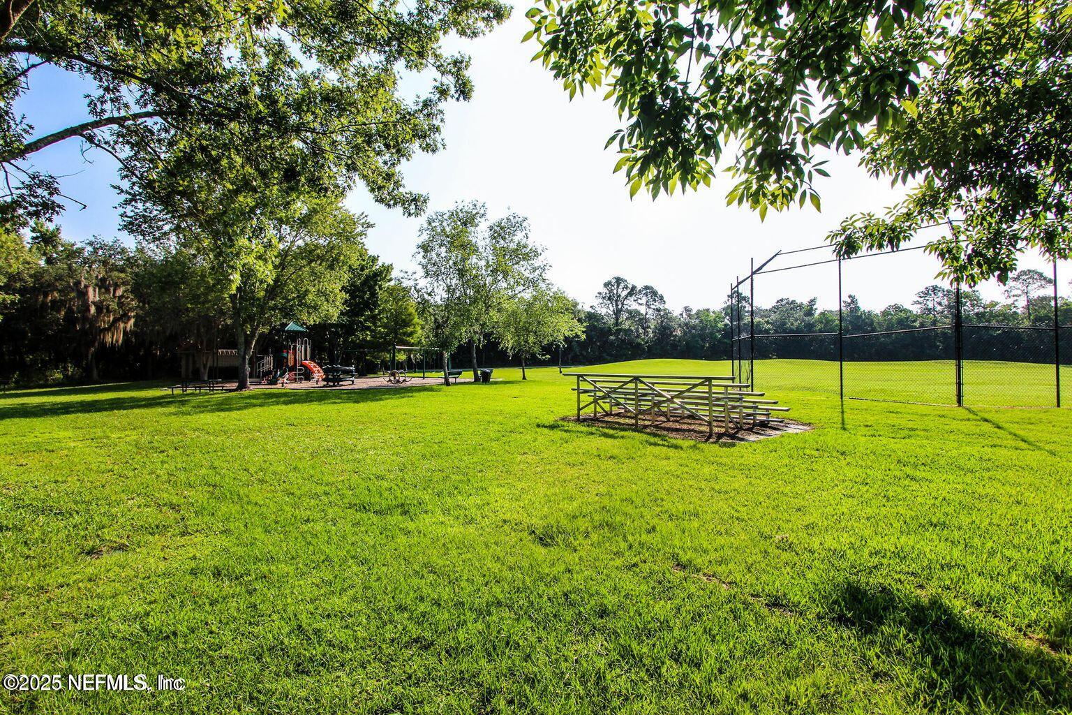 1940 Bluebonnet Way Fleming Island, FL 32003 - Photo 43 of 44 a view of a park with trees in the background