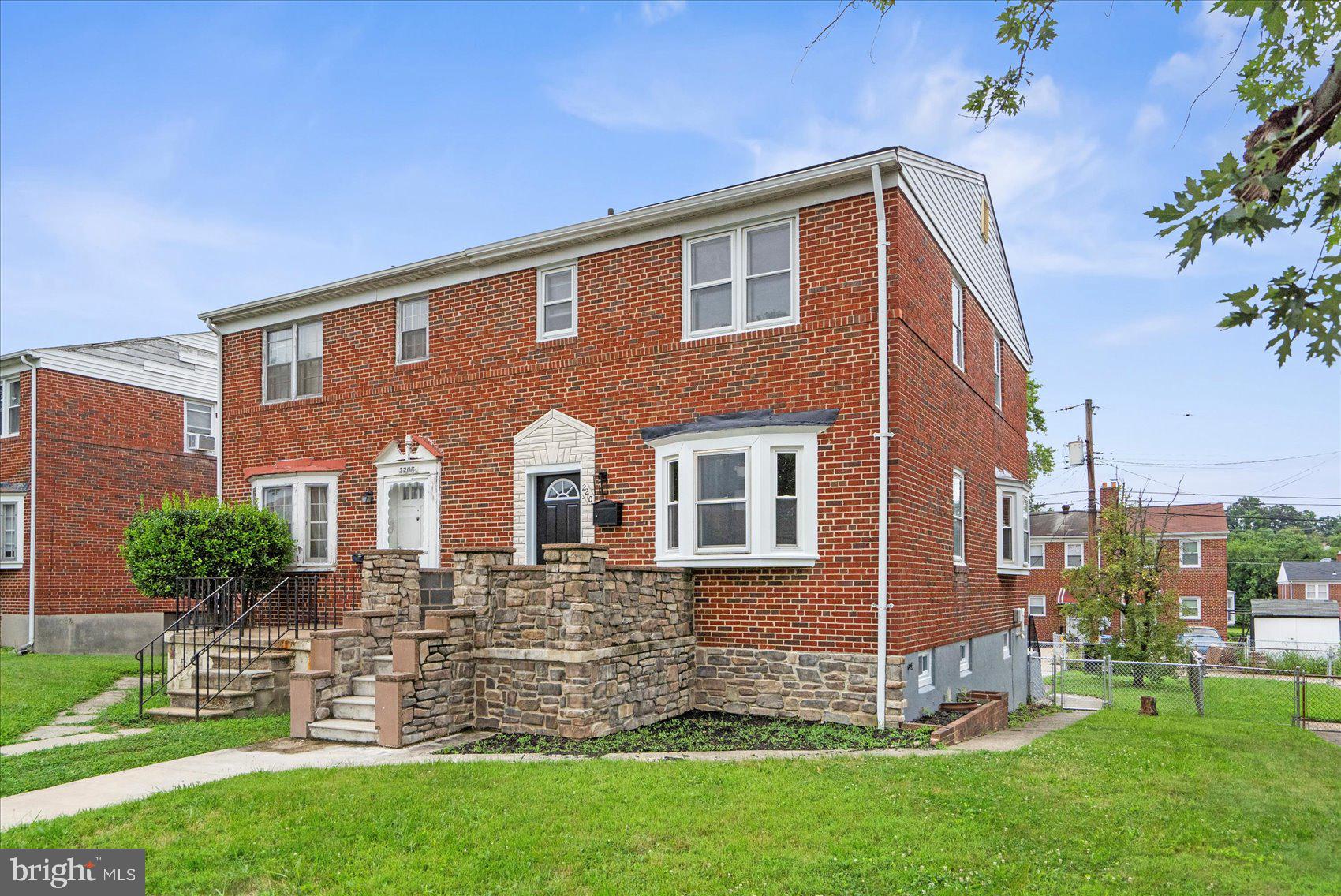 2210 Walshire Avenue Baltimore, MD 21214 - Photo 1 of 42 a front view of a house with a yard