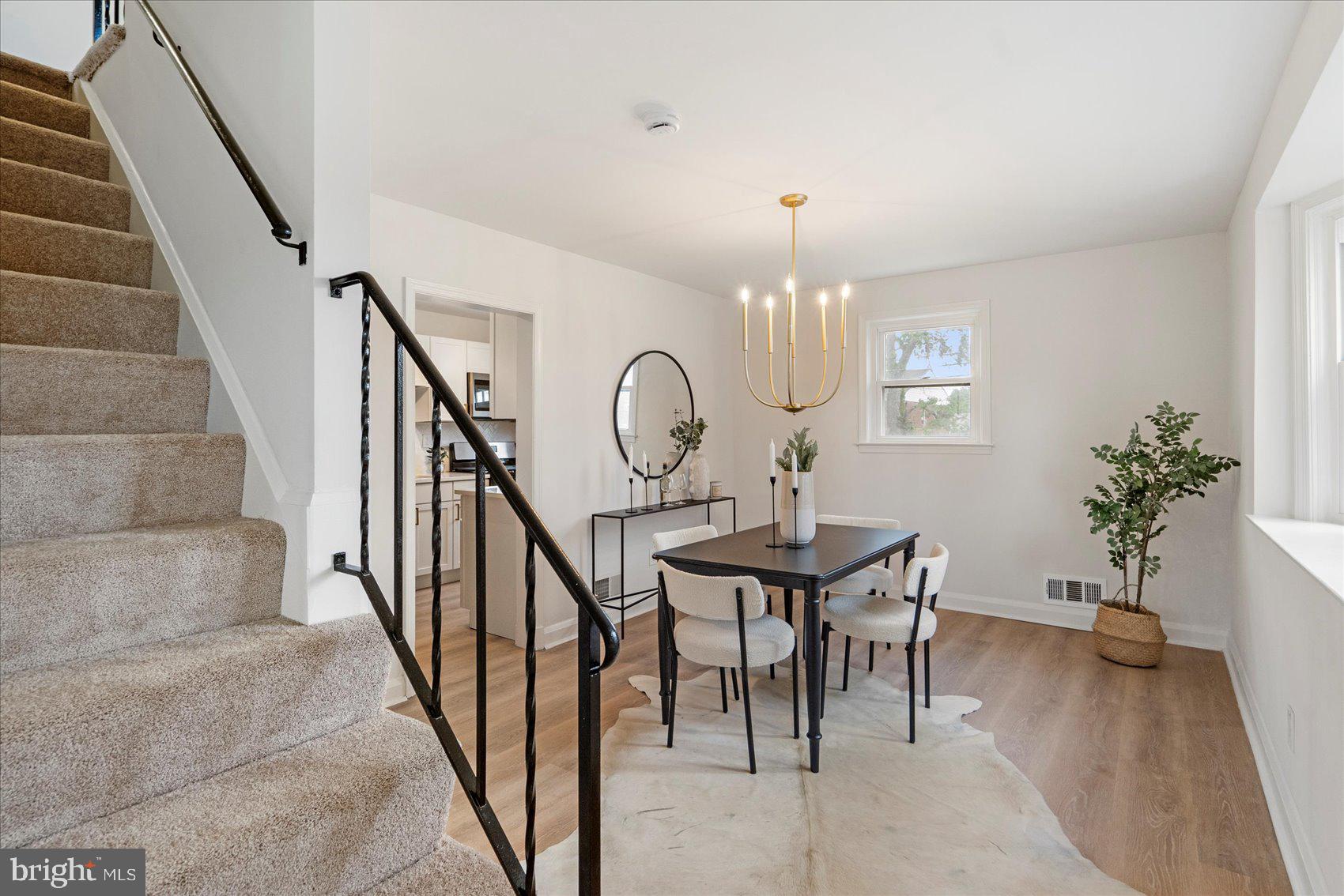 2210 Walshire Avenue Baltimore, MD 21214 - Photo 11 of 42 a view of a livingroom with furniture entryway wooden floor and a rug