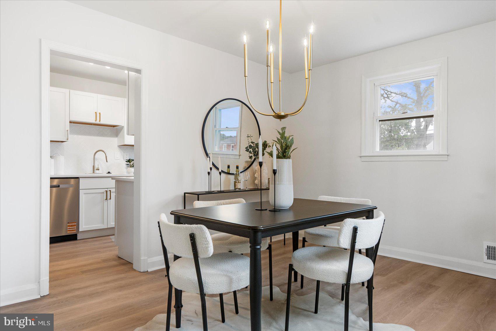 2210 Walshire Avenue Baltimore, MD 21214 - Photo 12 of 42 a view of a room that has a table and chairs in it