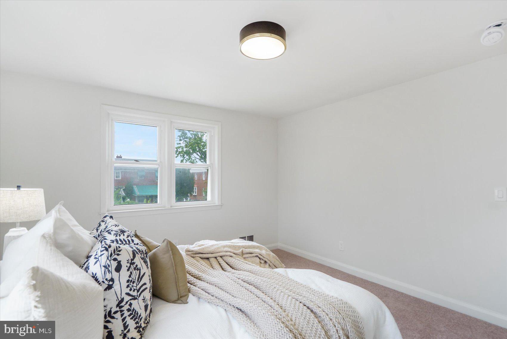 2210 Walshire Avenue Baltimore, MD 21214 - Photo 22 of 42 a bedroom with a bed and a window
