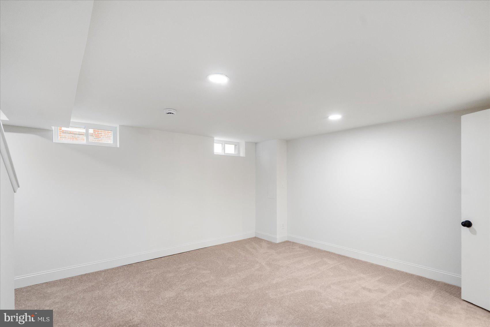 2210 Walshire Avenue Baltimore, MD 21214 - Photo 26 of 42 an empty room with a workbench