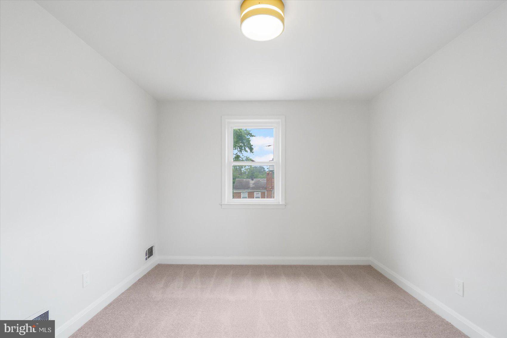 2210 Walshire Avenue Baltimore, MD 21214 - Photo 29 of 42 an empty room with a window