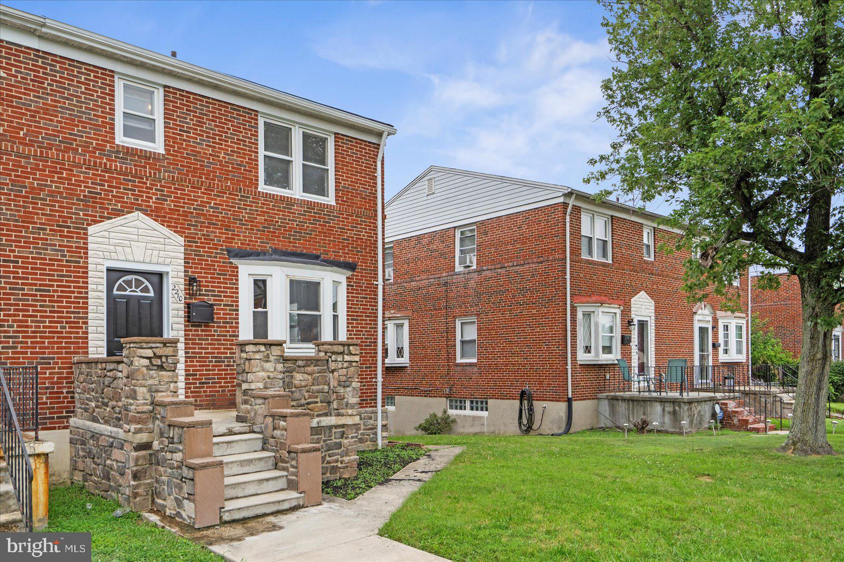 2210 Walshire Avenue Baltimore, MD 21214 - Photo 3 of 42 a front view of a house with a yard