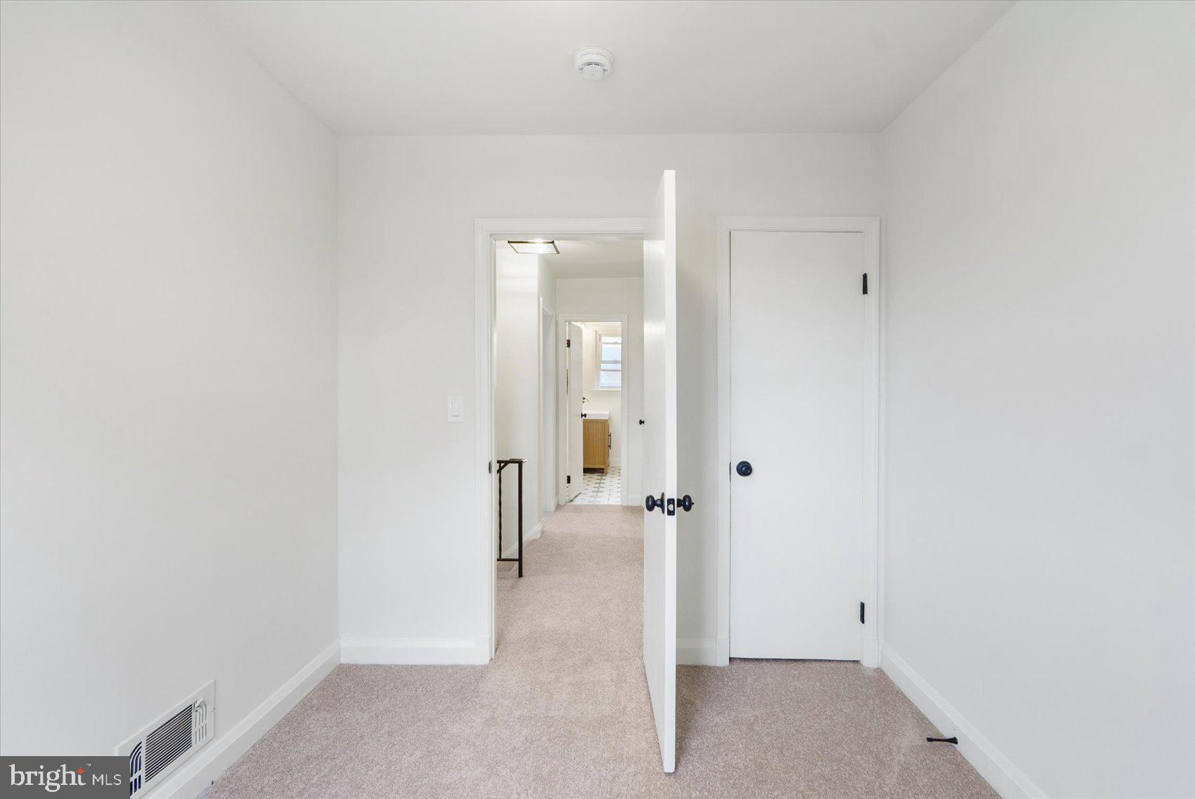 2210 Walshire Avenue Baltimore, MD 21214 - Photo 33 of 42 an empty room with a bench