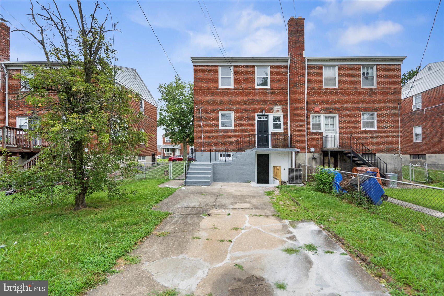 2210 Walshire Avenue Baltimore, MD 21214 - Photo 41 of 42 a front view of a house with garden