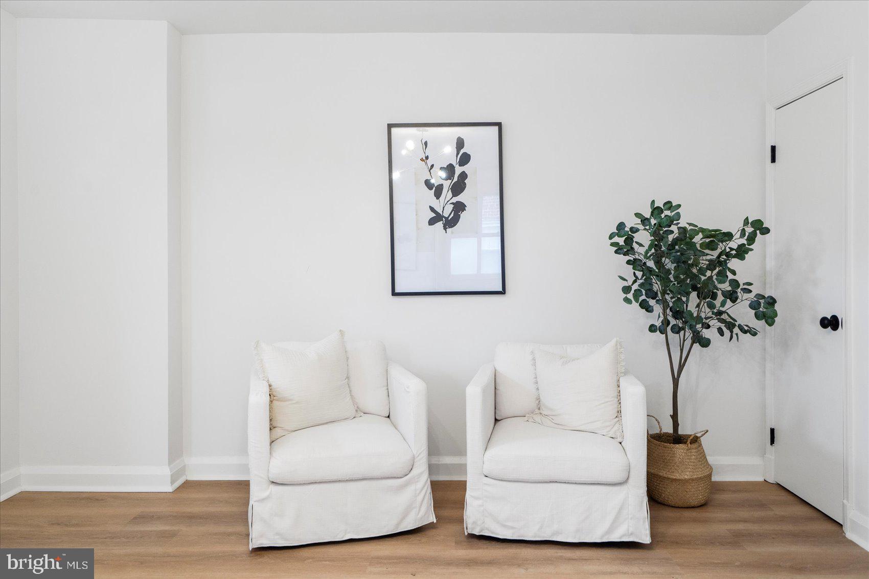 2210 Walshire Avenue Baltimore, MD 21214 - Photo 8 of 42 a living room with furniture and a potted plant