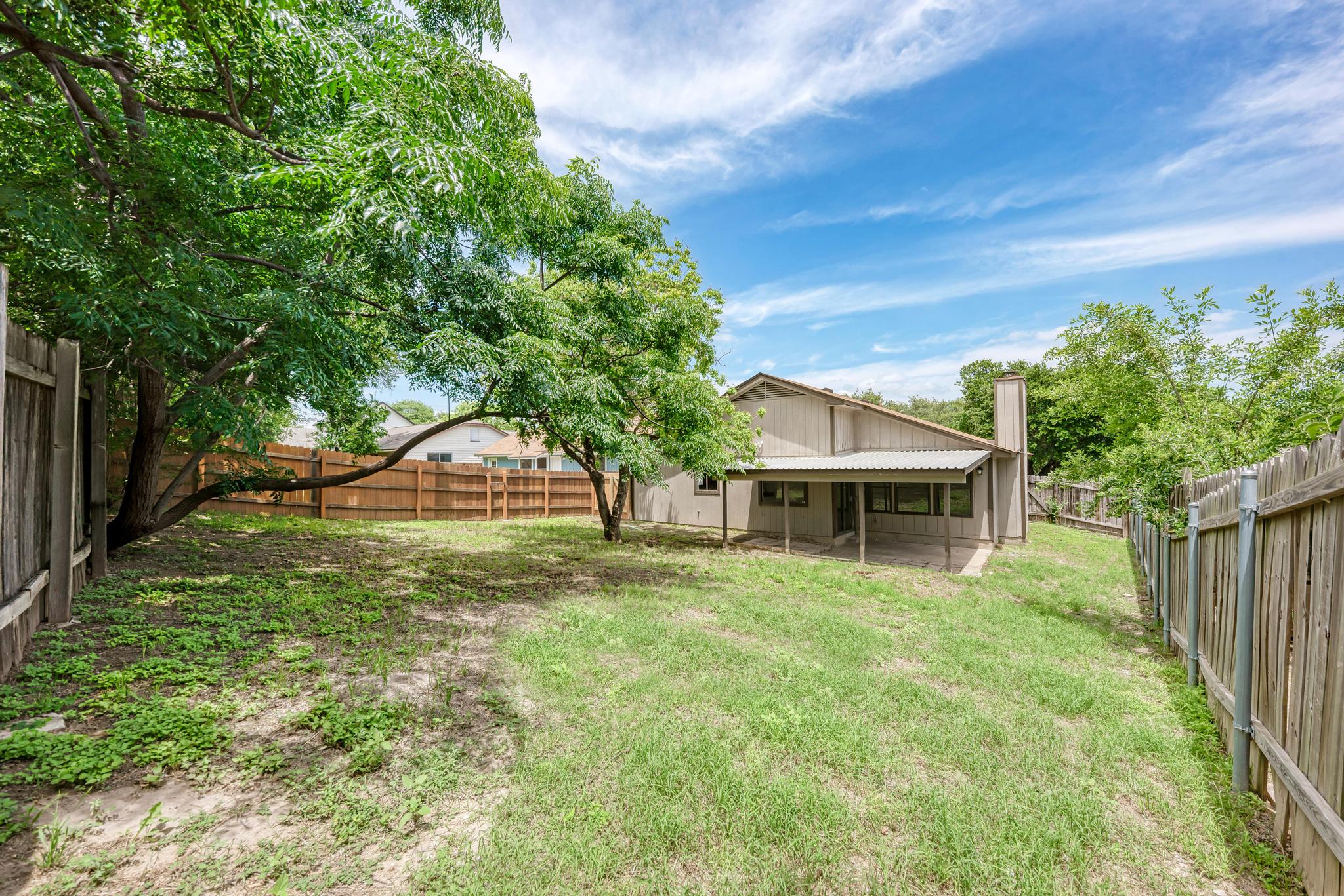 12108 Carnforth Drive Austin, TX 78753 - Photo 31 of 33 a front view of house with yard and green space