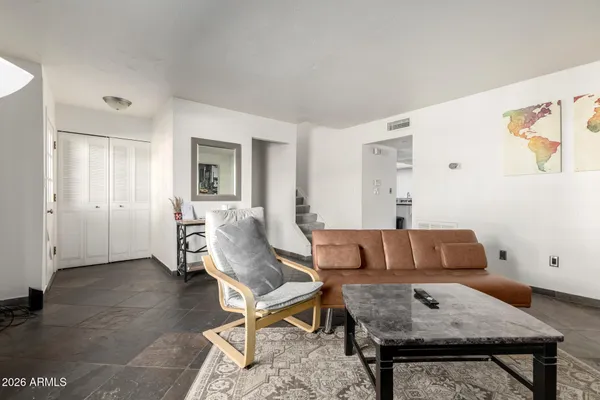 a living room with furniture and a window