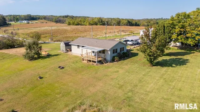 a aerial view of a house with a yard