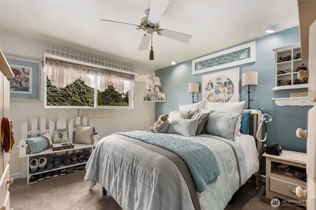 a bedroom with double bed and a window