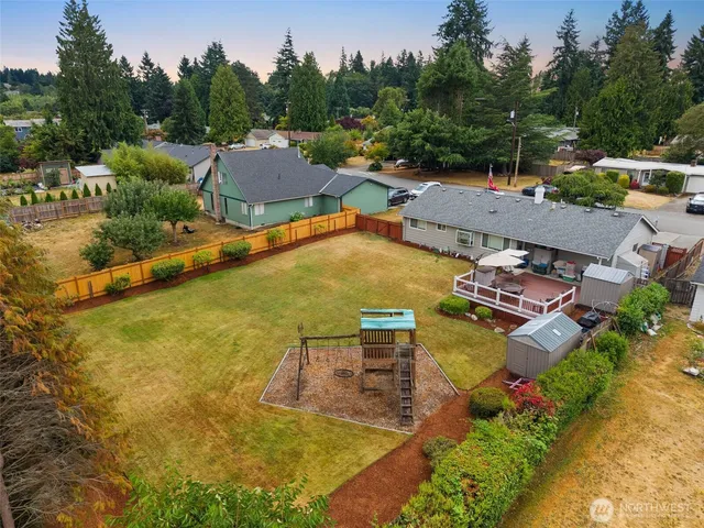 an aerial view of residential houses with outdoor space