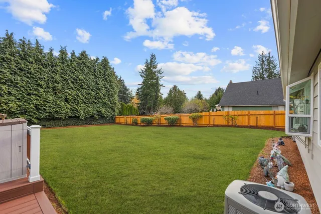 a view of a big yard with a house