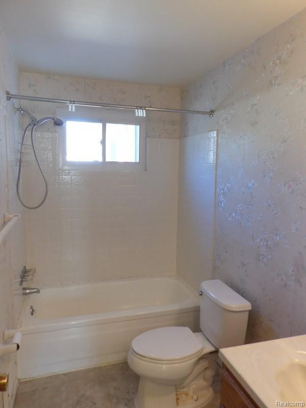 15580 Colbert Street Romulus, MI 48174 - Photo 16 of 25 The bath features an oak vanity with one piece molded sink!