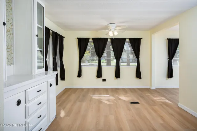 a bathroom with a sink a mirror and a shower