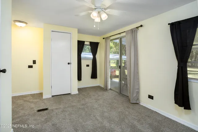 a view of a swimming pool with an outdoor space and seating area