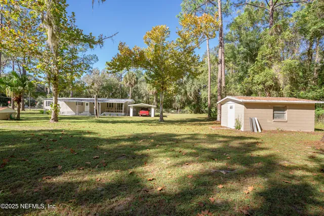 a view of a house with a big yard