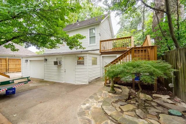 a view of a house with a yard and plants