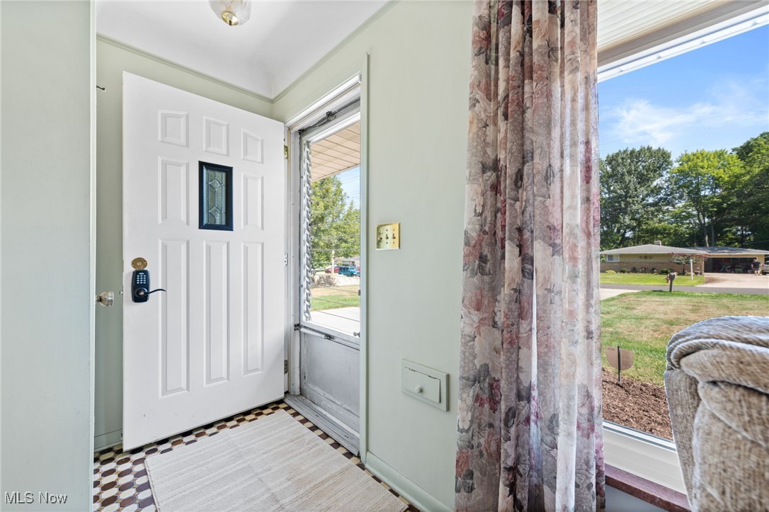7702 Ragall Parkway Cleveland, OH 44130 - Photo 4 of 41 Doorway featuring light tile patterned flooring and a wealth of natural light