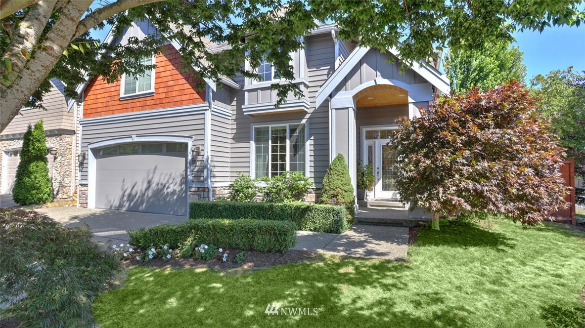 21131 37th Avenue Southeast Bothell, WA 98021 - Photo 2 of 40 a front view of a house with garden