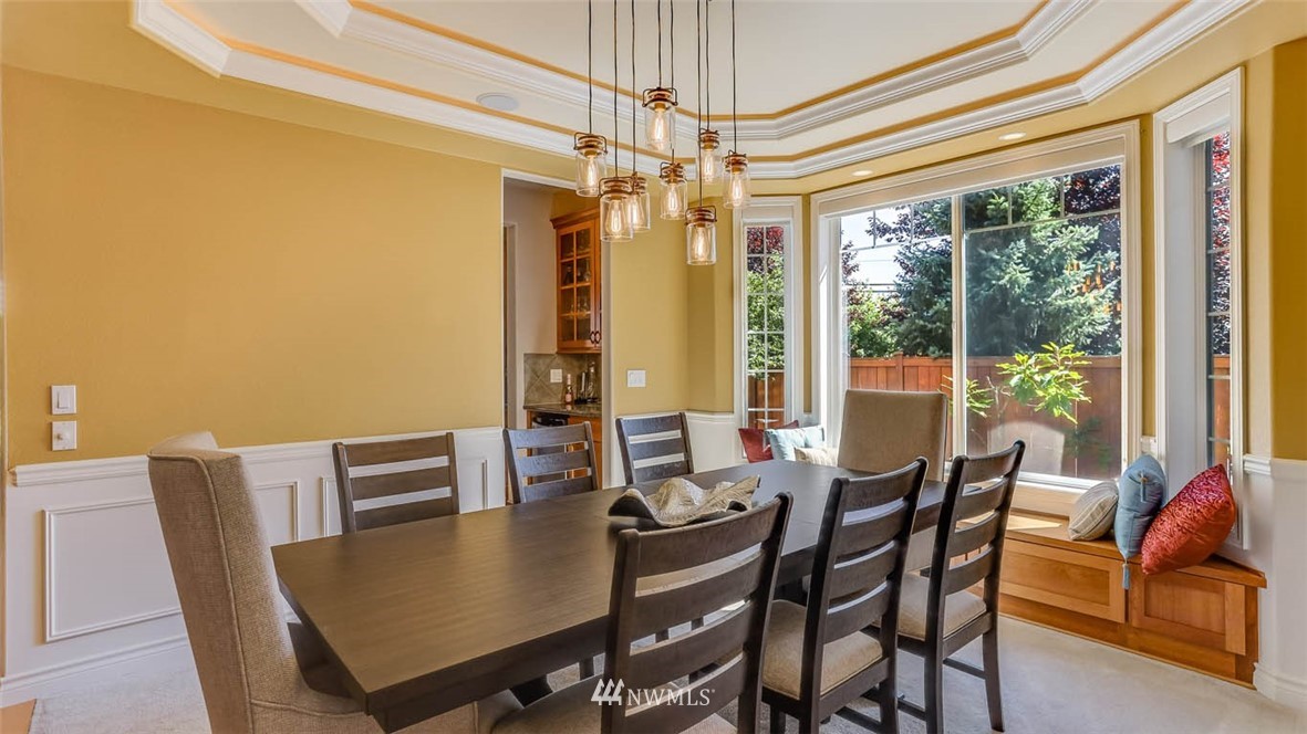 21131 37th Avenue Southeast Bothell, WA 98021 - Photo 11 of 40 a view of a dining room with furniture window and outside view