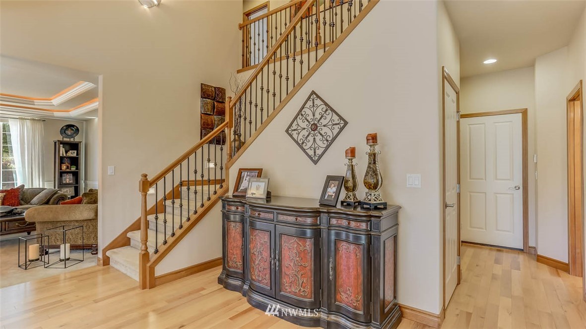21131 37th Avenue Southeast Bothell, WA 98021 - Photo 13 of 40 a view of entryway with wooden floor and stairs