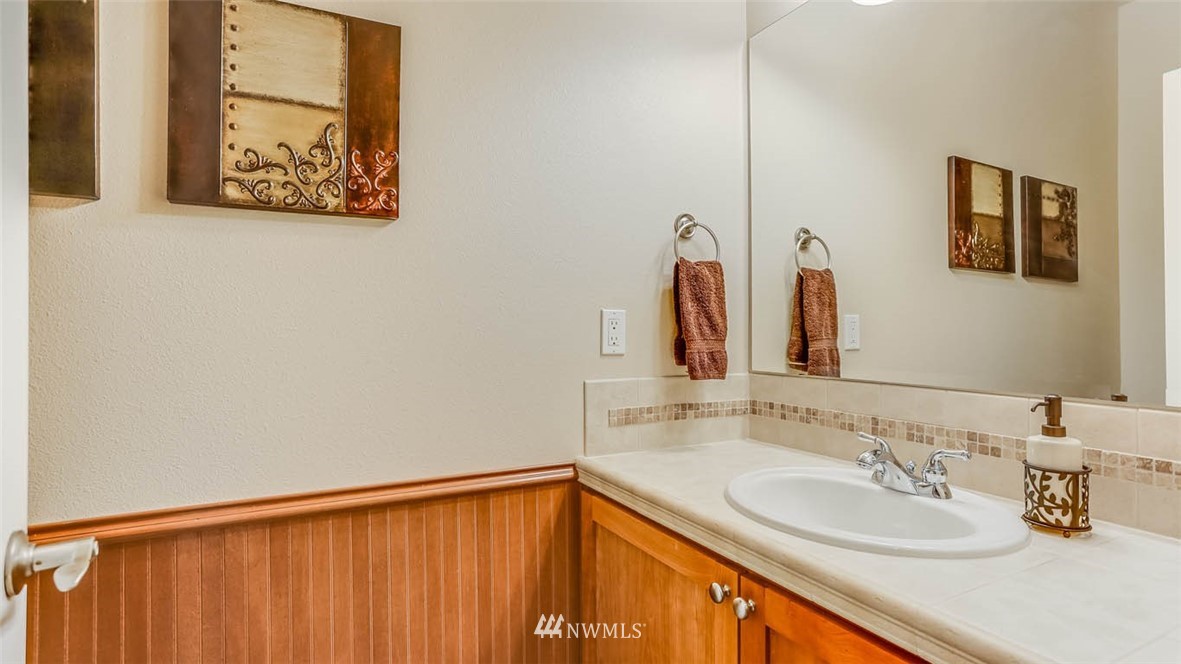21131 37th Avenue Southeast Bothell, WA 98021 - Photo 15 of 40 a bathroom with a sink and a mirror
