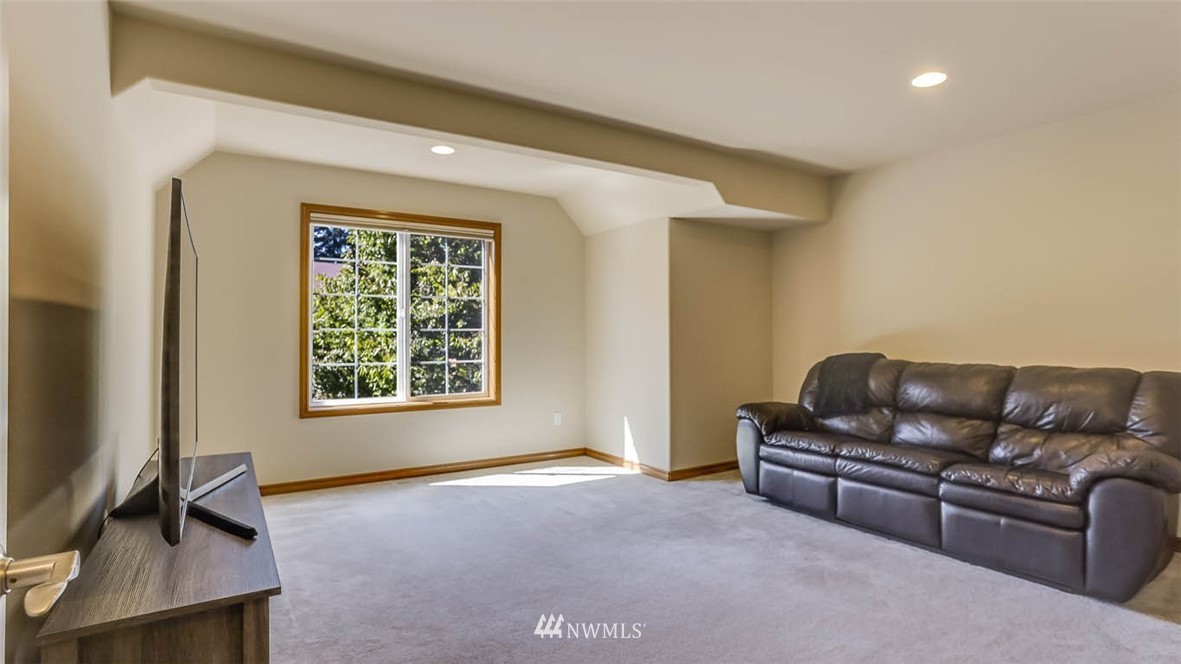 21131 37th Avenue Southeast Bothell, WA 98021 - Photo 32 of 40 a living room with furniture and a window