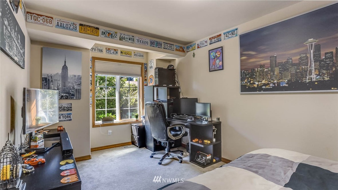 21131 37th Avenue Southeast Bothell, WA 98021 - Photo 36 of 40 a view of a workspace with furniture and a window
