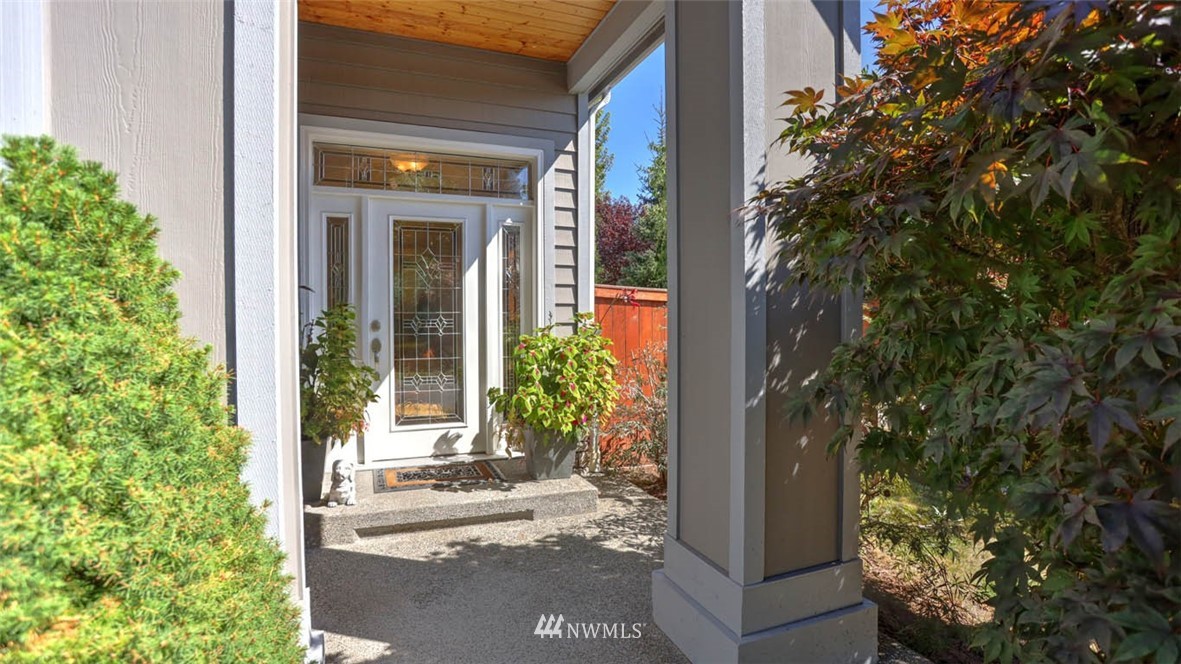 21131 37th Avenue Southeast Bothell, WA 98021 - Photo 5 of 40 a view of a door with a tree in front