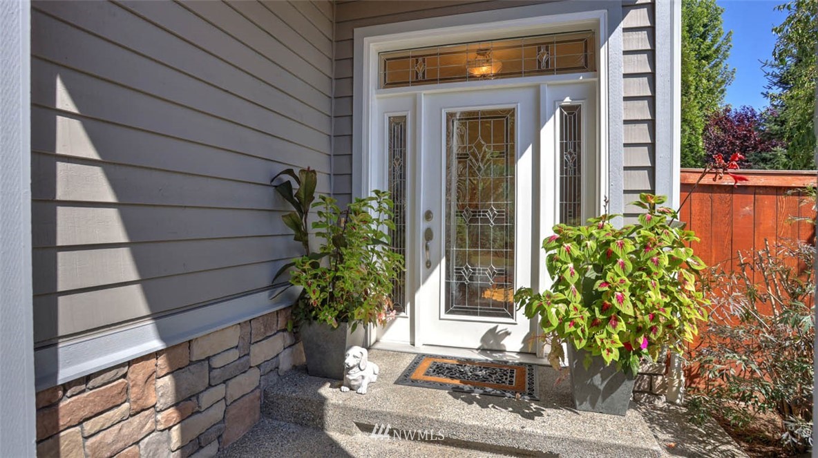 21131 37th Avenue Southeast Bothell, WA 98021 - Photo 6 of 40 a potted plant sitting in front of a house