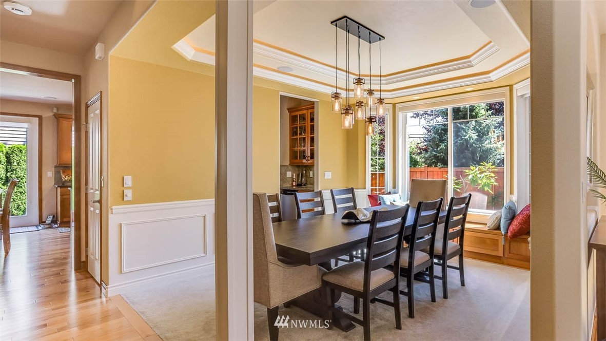 21131 37th Avenue Southeast Bothell, WA 98021 - Photo 10 of 40 a view of a dining room with furniture window and outside view