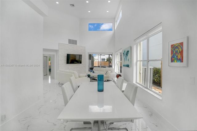 a living room with fireplace furniture and a flat screen tv