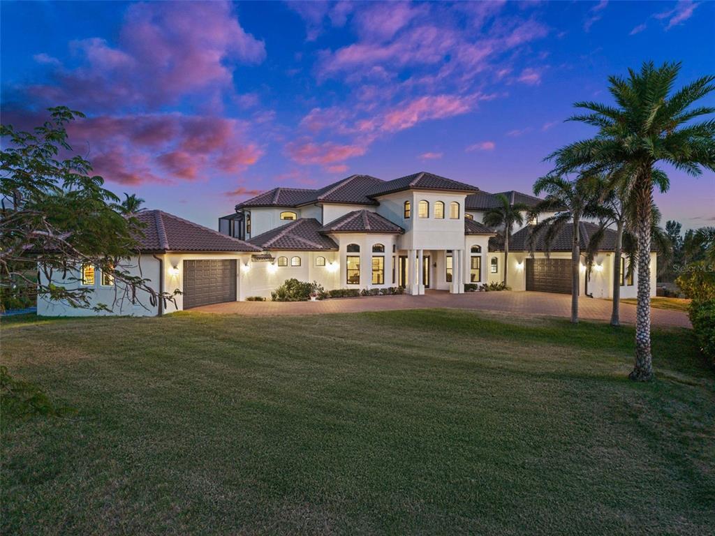10580 Poughkeepsie Circle Port Charlotte, FL 33981 - Photo 1 of 1 a front view of a house with a garden