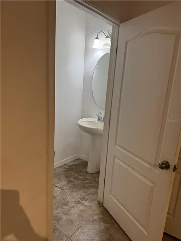 a bathroom with a sink and toilet