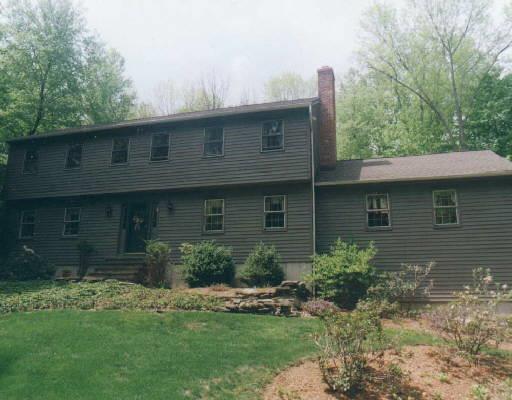161 Limekiln Road Ridgefield, CT 06877 - Photo 1 of 1 a front view of a house with a garden